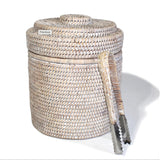 A beige round ice bucket liner with a thermos liner and ice tongs.