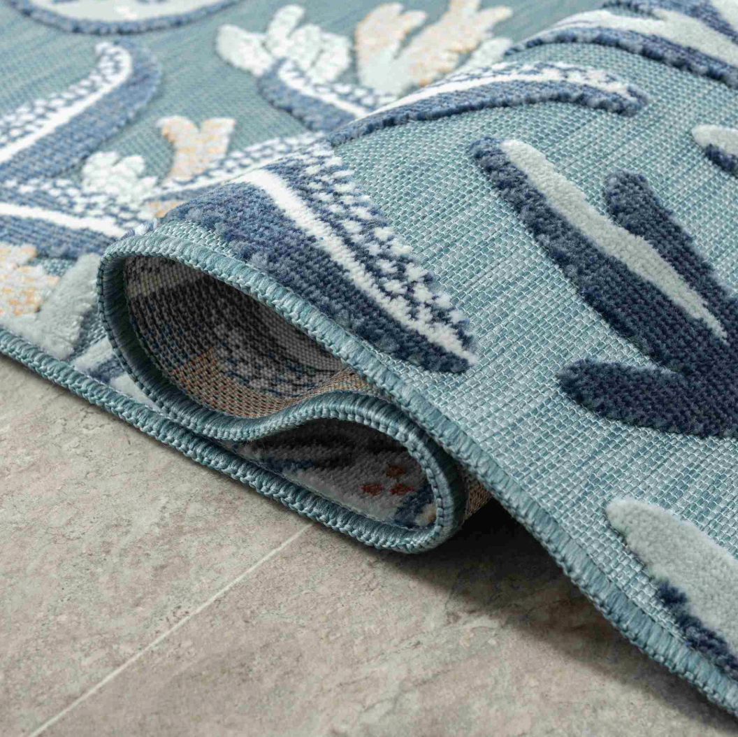Close-up of a blue-patterned rug.
