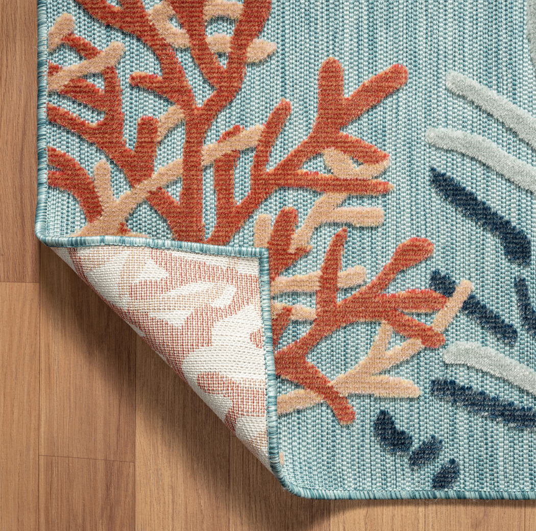 Close-up of a textured  Aqua Multi Rug! This versatile indoor/outdoor rug.