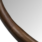 Close-up of a wooden frame on mirror.