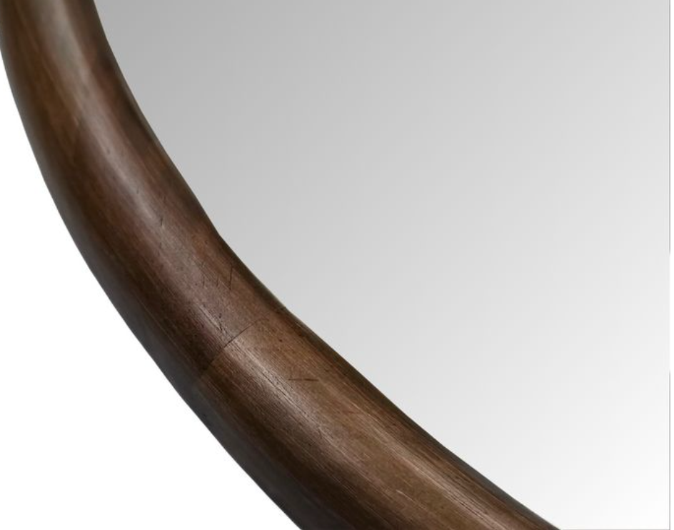 Close-up of a wooden frame on mirror.