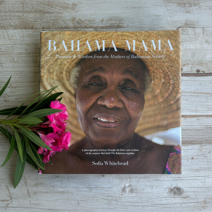 Book titled 'Bahama Mama' with a woman's face on the cover, featuring a straw hat and pink flowers.