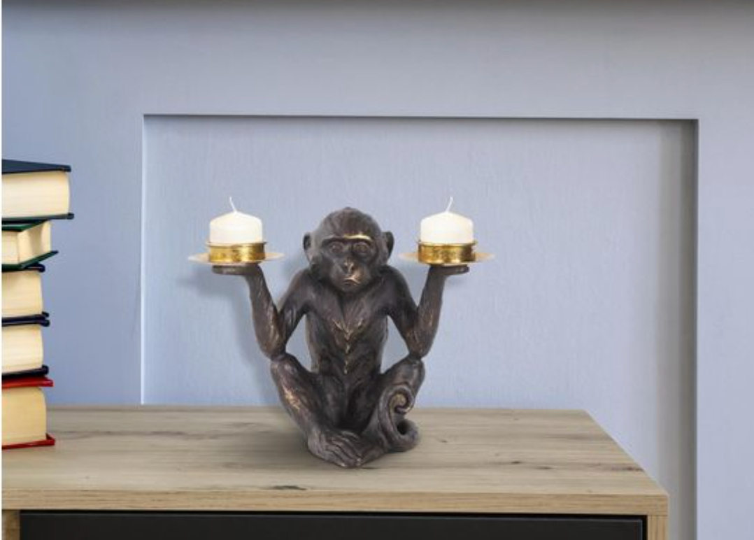 Monkey candle holder with two candles.