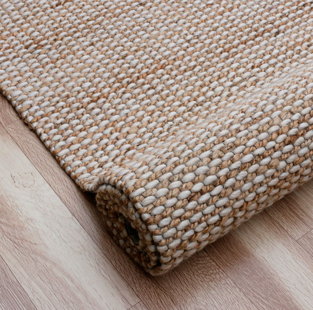 Textured beige rug.