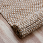 Textured beige rug.