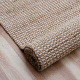 Textured beige rug.