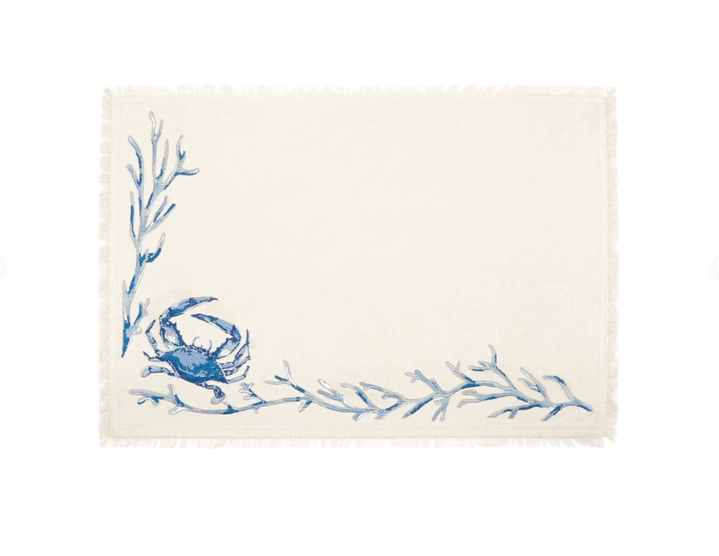 An off-white woven placemat with a blue crab and blue seaweed branch design in the lower-left corner.