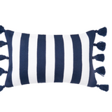 A rectangular throw pillow with vertical navy blue and white stripes and matching navy tassels on the sides,.
