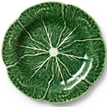 A round ceramic plate designed to look like a green cabbage leaf, featuring raised leaf veins and a small white center hole.
