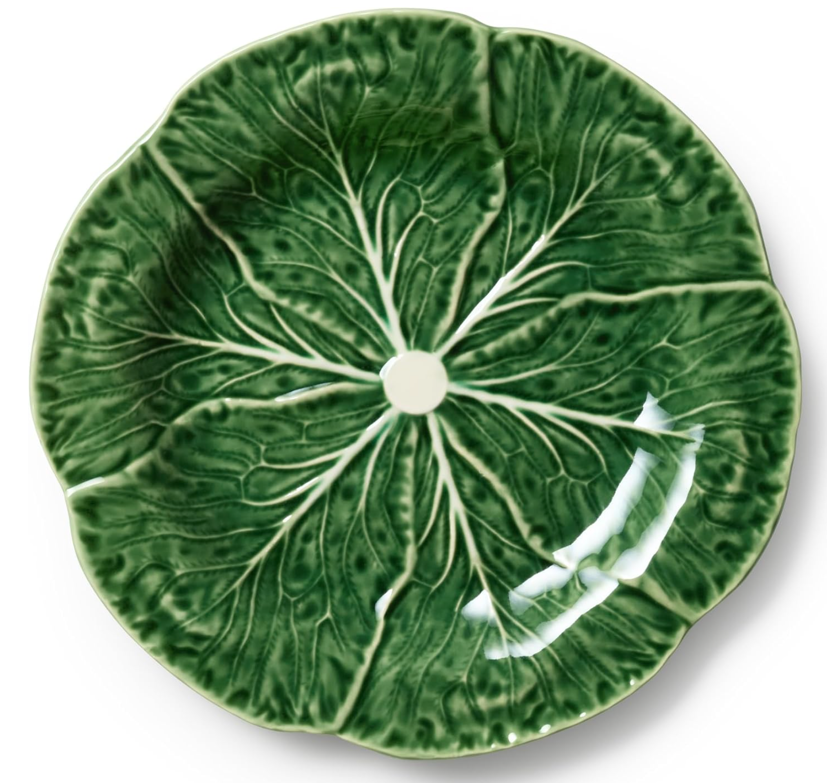 A round ceramic plate designed to look like a green cabbage leaf, featuring raised leaf veins and a small white center hole.