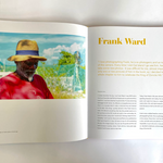 An open book or magazine spread showing a printed portrait of a man in a straw hat and red shirt under the name 'Frank Ward,' with text columns on the right page.