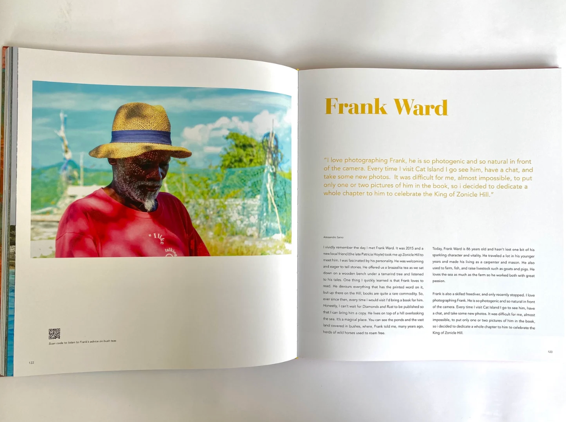 An open book or magazine spread showing a printed portrait of a man in a straw hat and red shirt under the name 'Frank Ward,' with text columns on the right page.