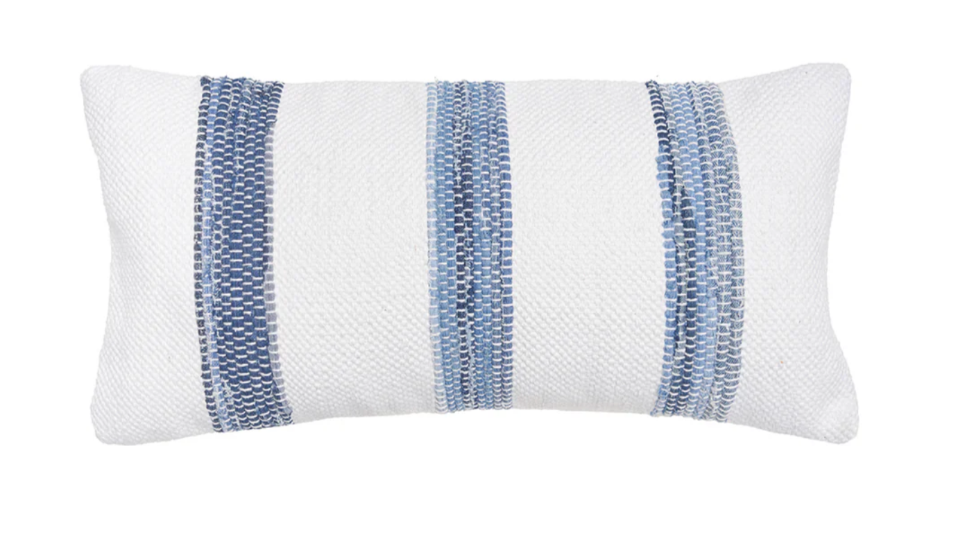White pillow with blue striped pattern.
