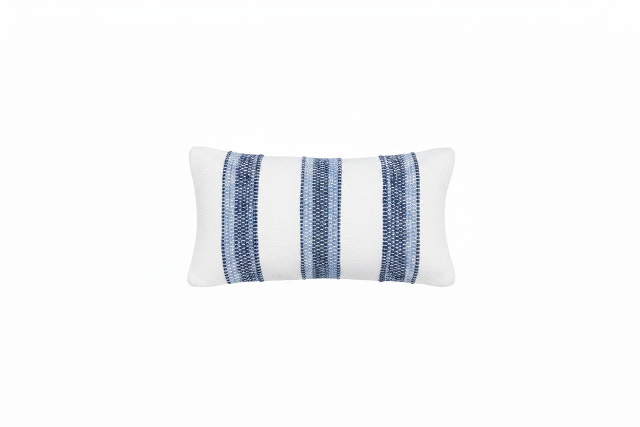 White pillow with blue striped pattern. 