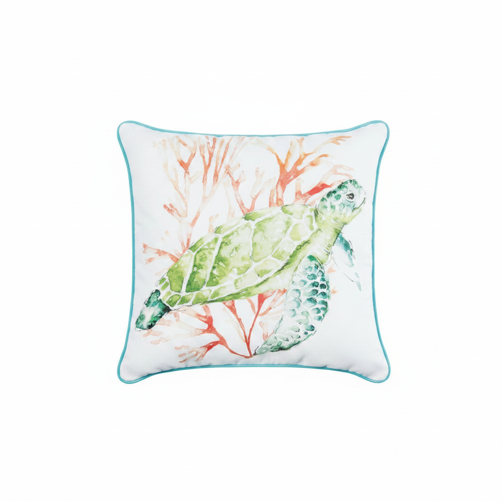 A square white throw pillow with a turquoise border, featuring a watercolor illustration of a green sea turtle swimming among coral.