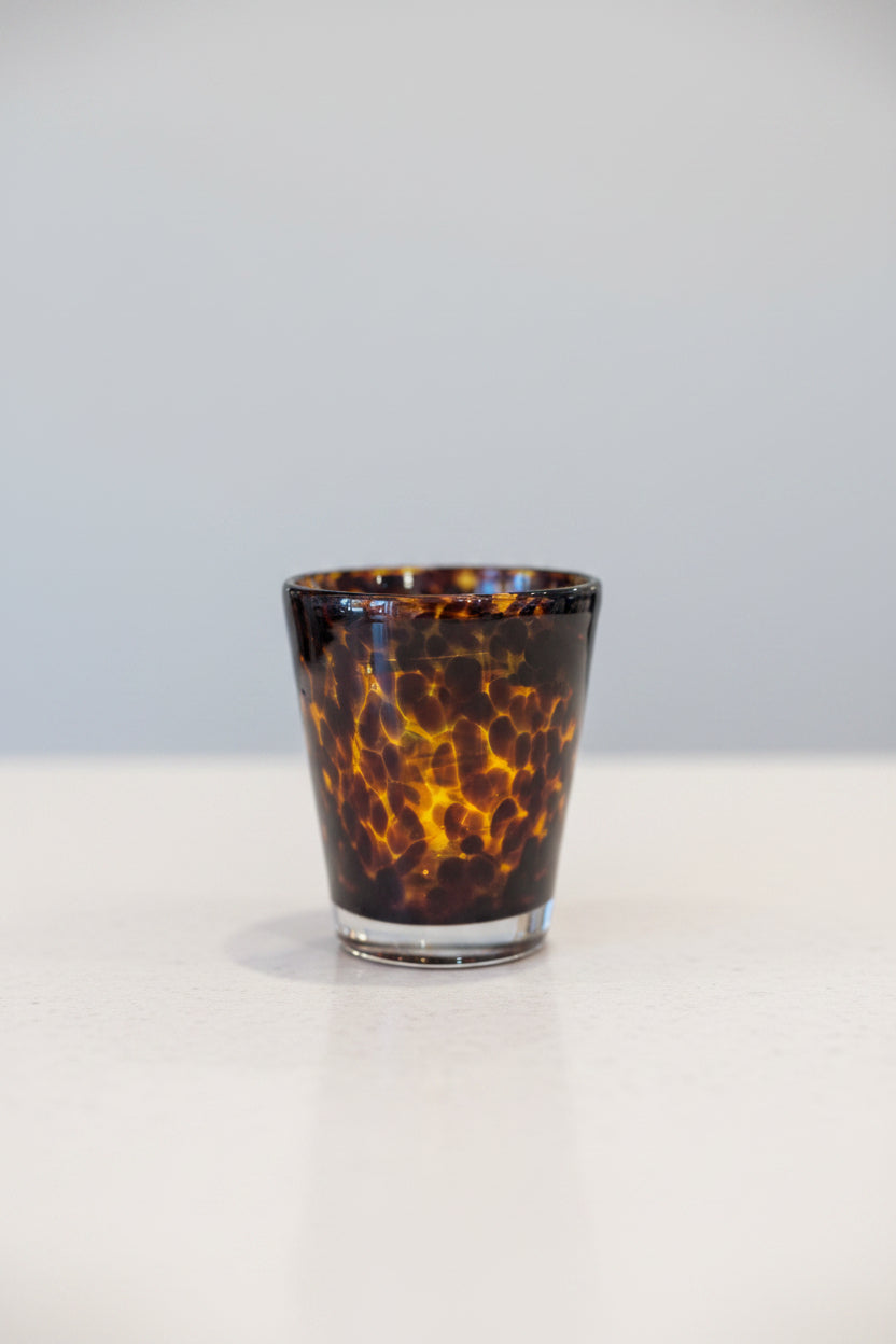 A tortoise print double old fashion glass with a heavyweight.