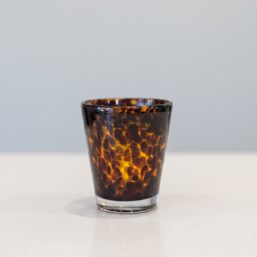 A tortoise print double old fashion glass with a heavyweight.