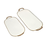 Featuring a timeless white and gold finish paired with natural rattan-wrapped handles.