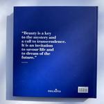 A hardcover book titled 'Beauty is a key to the mystery and a call to transcendence' by Paul Beaulieu, featuring a dark blue cover with white text.