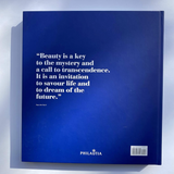 A hardcover book titled 'Beauty is a key to the mystery and a call to transcendence' by Paul Beaulieu, featuring a dark blue cover with white text.