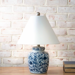 Table lamp with blue floral pattern.