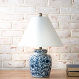 Table lamp with blue floral pattern.