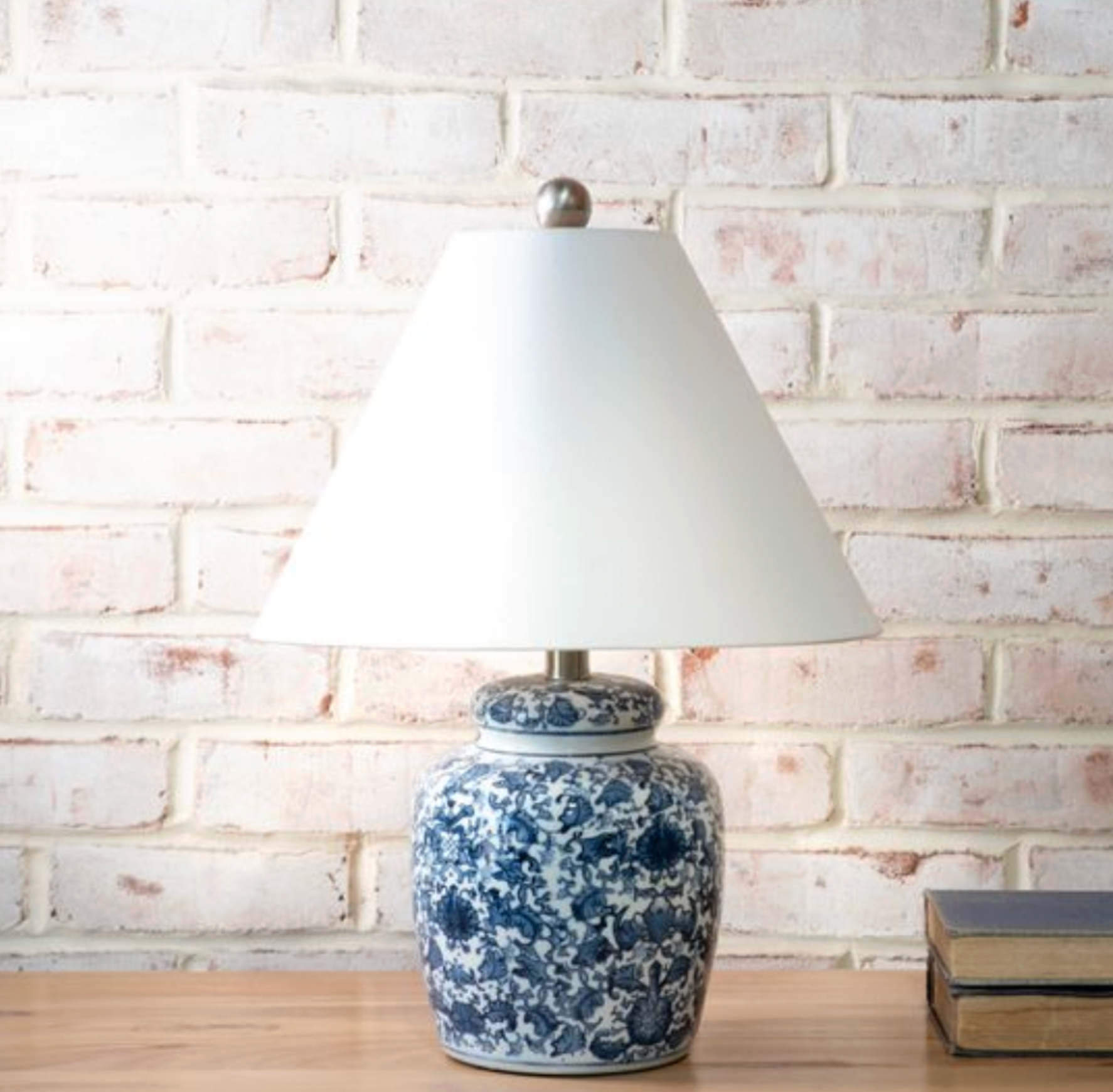 Table lamp with blue floral pattern.