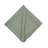 Soft sea glass napkins with delicate fringe detailing bring coastal elegance to your table. Each 22 x 22 inch napkin in this set of four offers generous coverage and versatile styling for everyday dining or special occasions. 