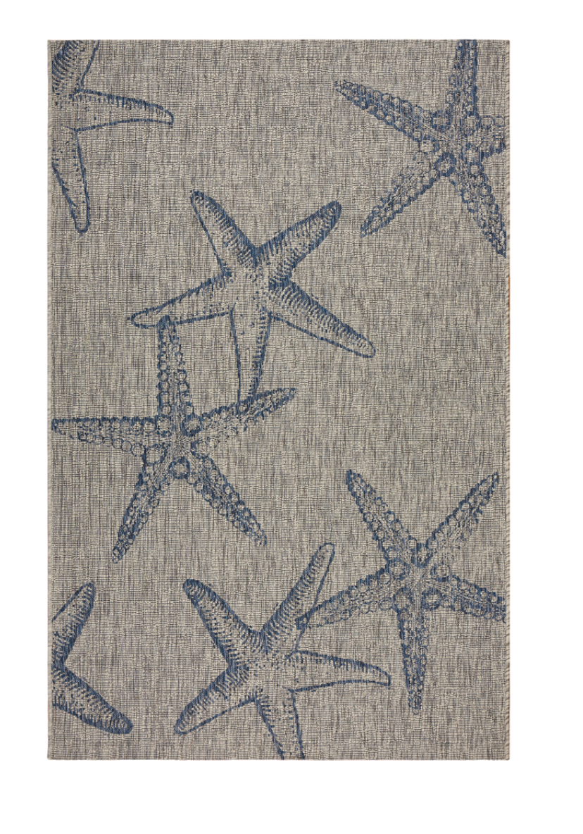Textile with a starfish pattern rug.