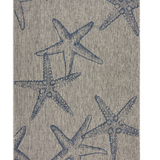 Textile with a starfish pattern rug.