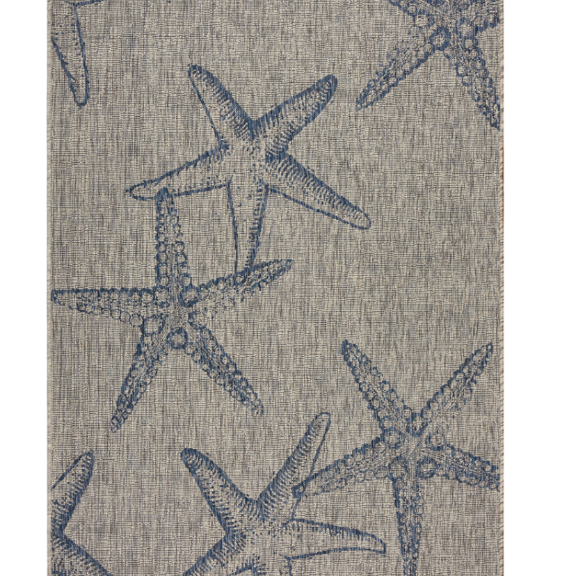 Textile with a starfish pattern rug.
