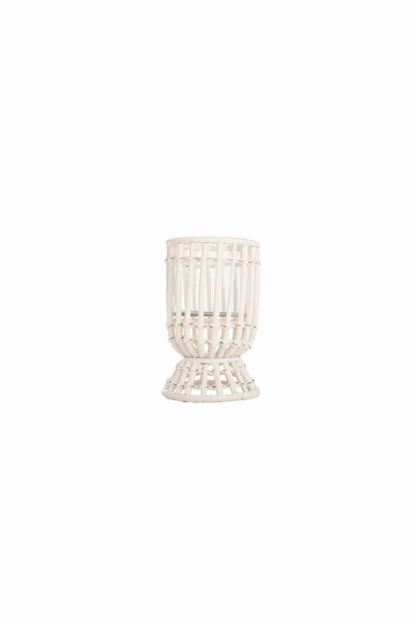 A white hurricane lamp with a woven design, featuring a removable glass insert.