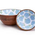 Two wooden bowls, one with a blue floral pattern.