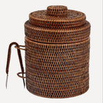 A round brown wicker ice bucket.