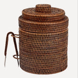 A round brown wicker ice bucket.
