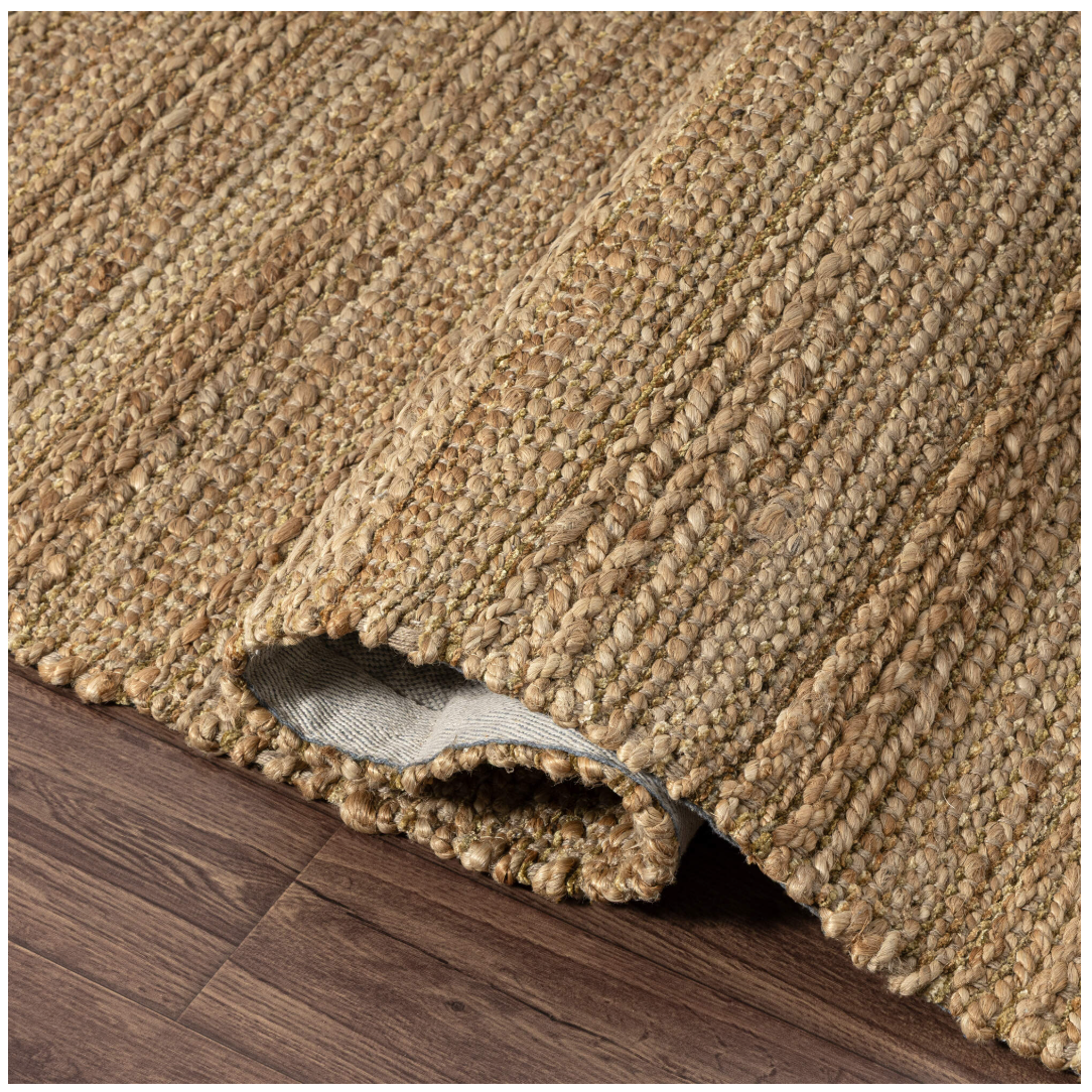 Beige textured rug .