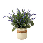 Potted plant with lavender and green leaves in a decorative pot.