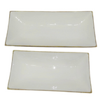 Two rectangular glossy white ceramic serving platters.