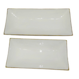 Two rectangular glossy white ceramic serving platters.