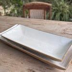 Two white ceramic trays.