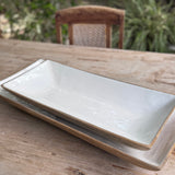 Two white ceramic trays.