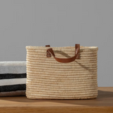 Durable leather handles provide comfortable carrying for everyday storage and organization