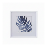 Framed botanical wall art featuring a single palm leaf print centered within a white mat and white frame.