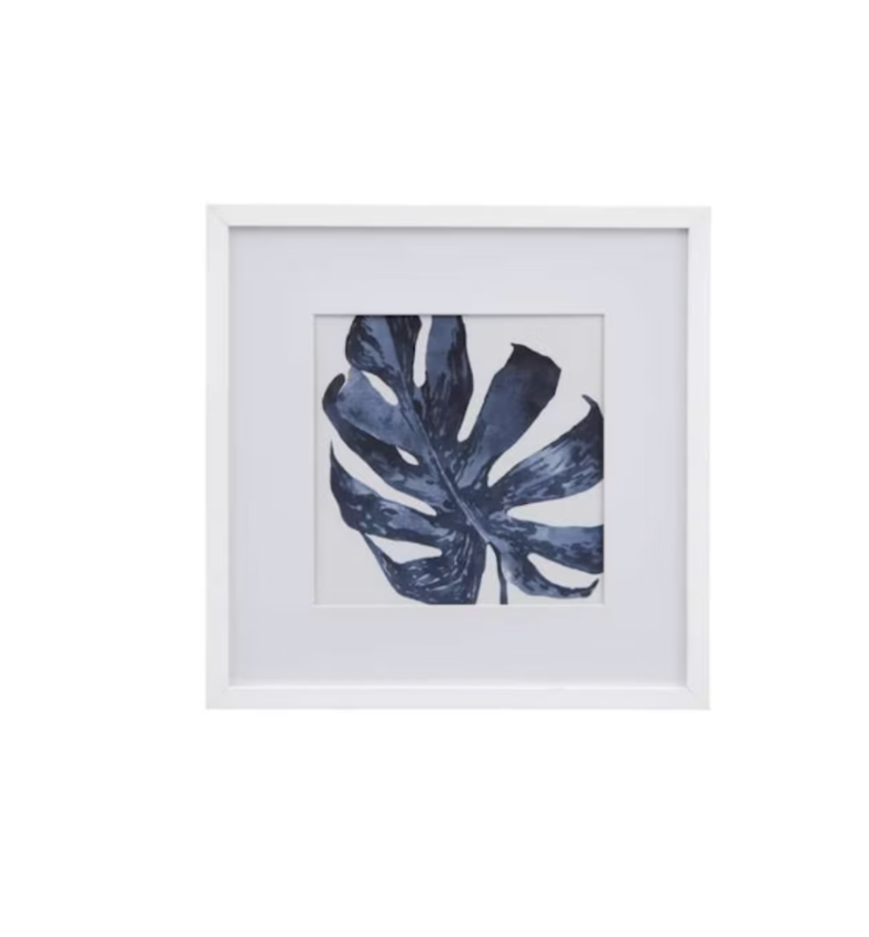 Framed botanical wall art featuring a single large monstera leaf 