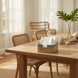 Compact napkin holder crafted from natural rattan, perfect for keeping napkins organized and within reach on your dining table or kitchen counter.