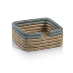 Compact napkin holder crafted from natural rattan.