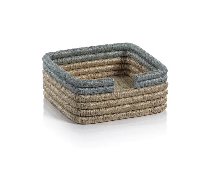 Compact napkin holder crafted from natural rattan.