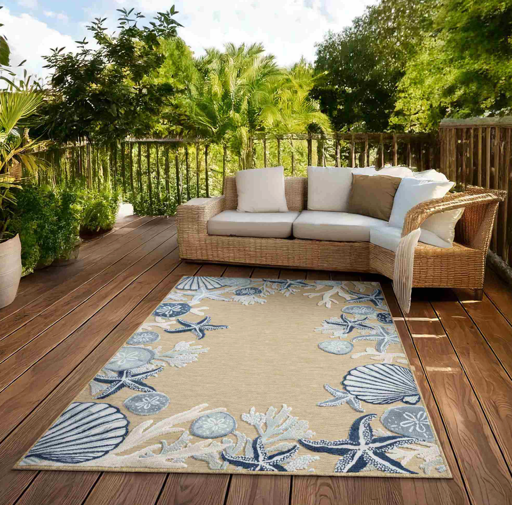 Beige rug with blue and gray shell, starfish, and coral pattern