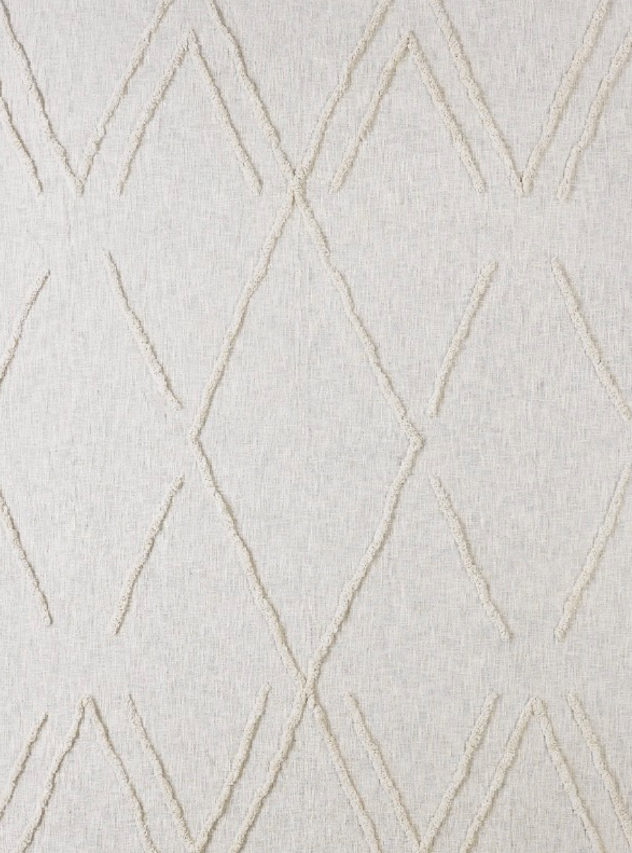 Close-up of textured fabric with geometric pattern.