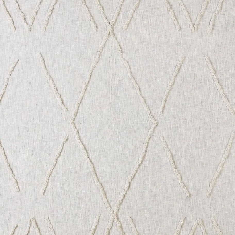 Close-up of textured fabric with geometric pattern.